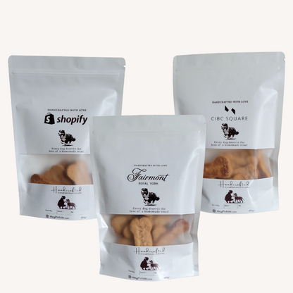 Three packages of dog treats with visible branding on a white background